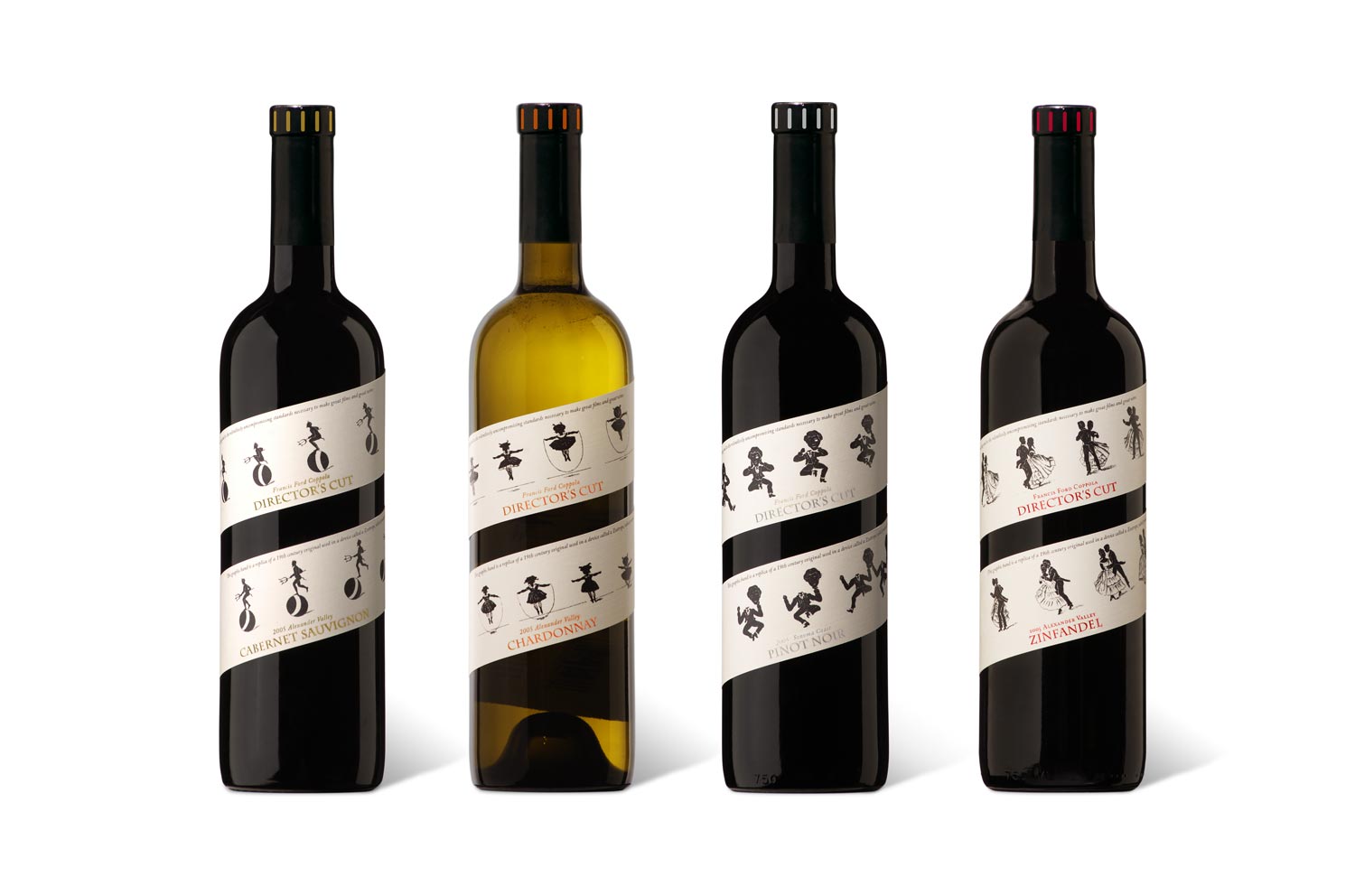 Four Director’s Cut wine bottles with illustrated spiral labels and coloured capsule accents
