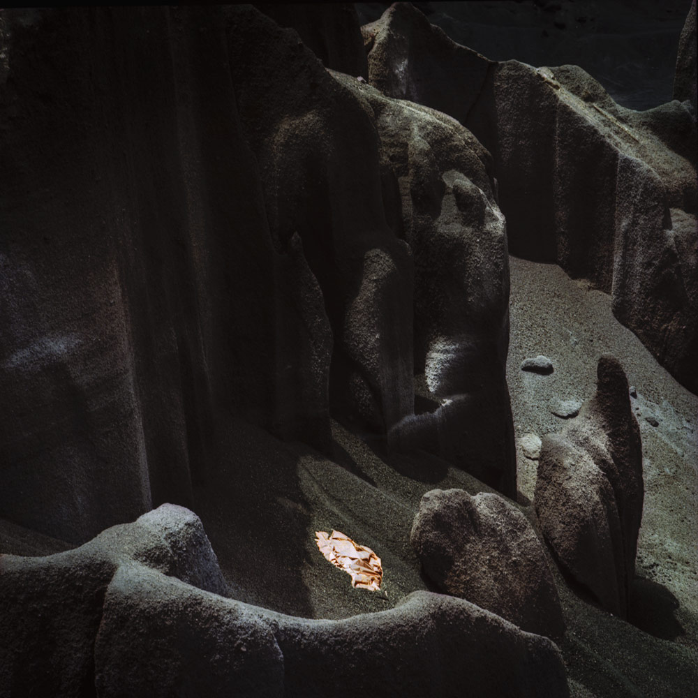 A copper sheet nestled among volcanic rock formations